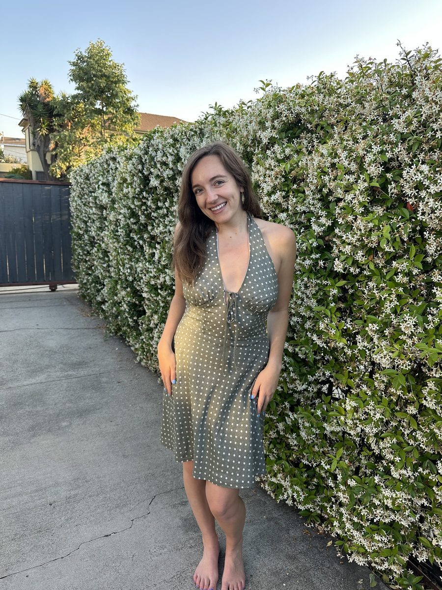 Emily wearing her first Margot dress, cut on the bias in a sage green polka dot fabric
